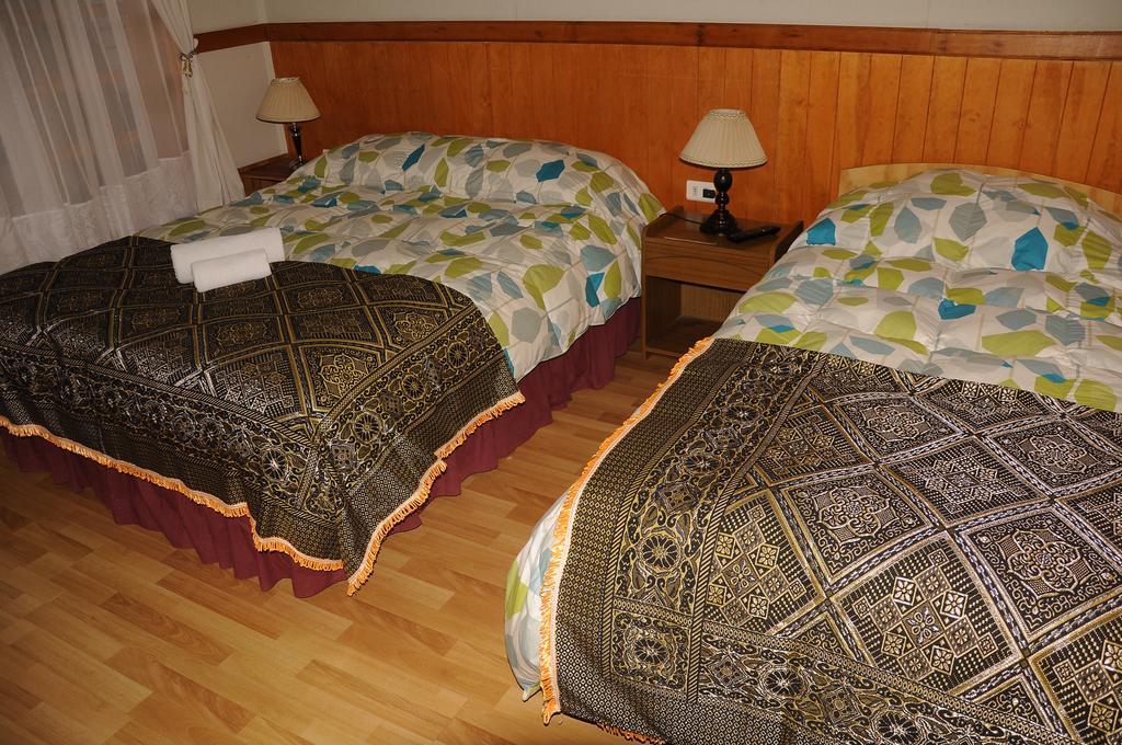 Hostal El Rincón Puerto Natales Quarto foto